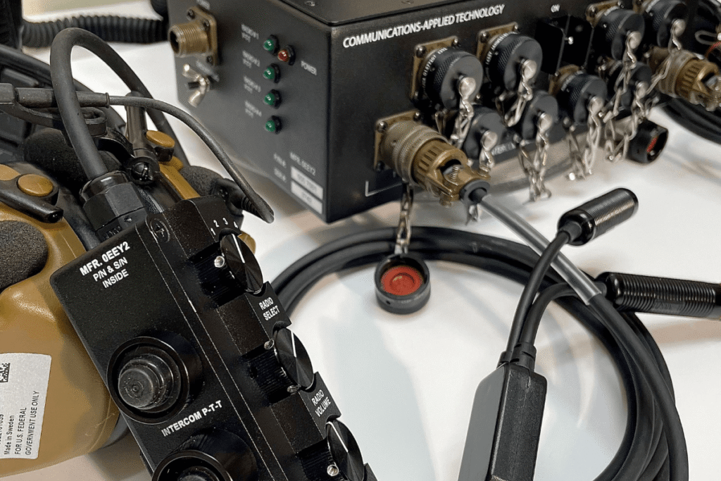 C-AT COMFORCE vehicle intercom system showing ICU controller, headset, and crew audio connection